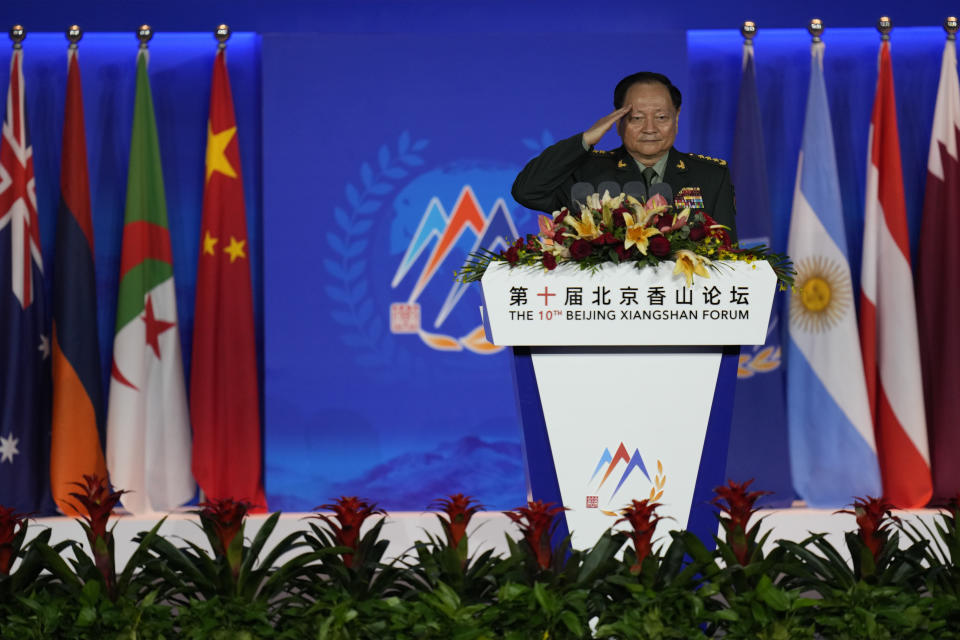 Zhang Youxia, Chinese general in the People's Liberation Army (PLA), salutes on stage as he delivers his opening speech for the Xiangshan Forum, a gathering of the region's security officials, in Beijing, Monday, Oct. 30, 2023. (AP Photo/Ng Han Guan)