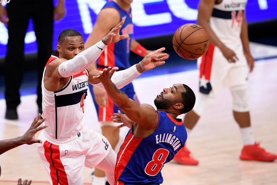 Washington Wizards guard Russell Westbrook (4) passes the ball past Detroit Pistons guard Wayne Ellington (8) during the first half Saturday, April 17, 2021, in Washington.