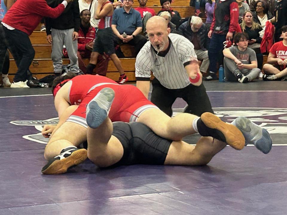 Mike Ahern works at a recent JV jamboree meet at Cherry Hill West High School on Saturday. After a standout career as a wrestler and a coach, Ahern is a first-year official.