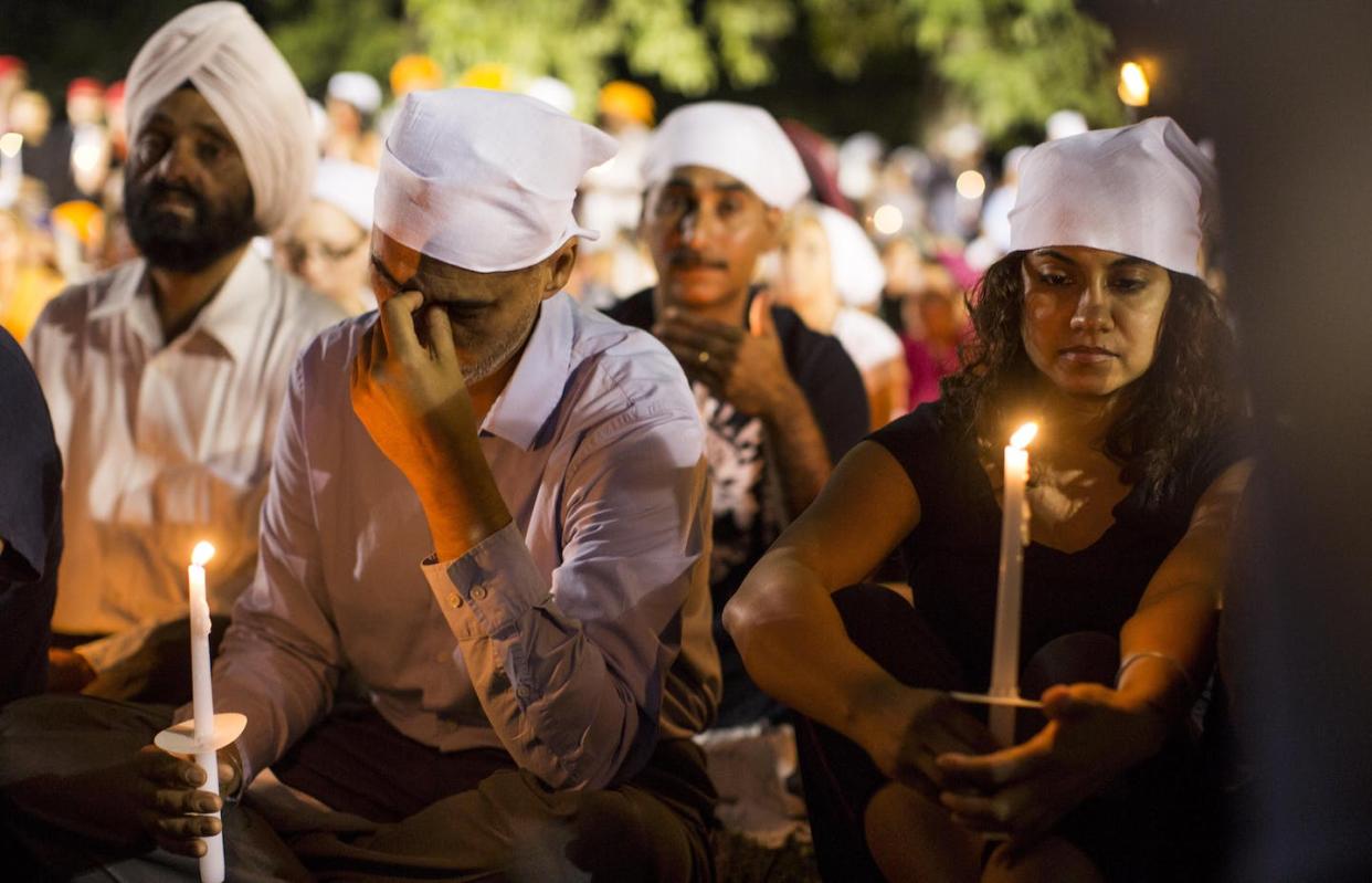 A candlelight vigil in Oak Creek for the victims of a mass shooting at the Sikh Temple of Wisconsin in August 2012. <a href="https://newsroom.ap.org/detail/SikhTemple-Shooting/7cb40719da8c4c9bb2219192e64a18b7/photo?Query=sikhs%20united%20states&mediaType=photo&sortBy=&dateRange=Anytime&totalCount=735&currentItemNo=61" rel="nofollow noopener" target="_blank" data-ylk="slk:AP Photo/Tom Lynn, File;elm:context_link;itc:0;sec:content-canvas" class="link ">AP Photo/Tom Lynn, File</a>