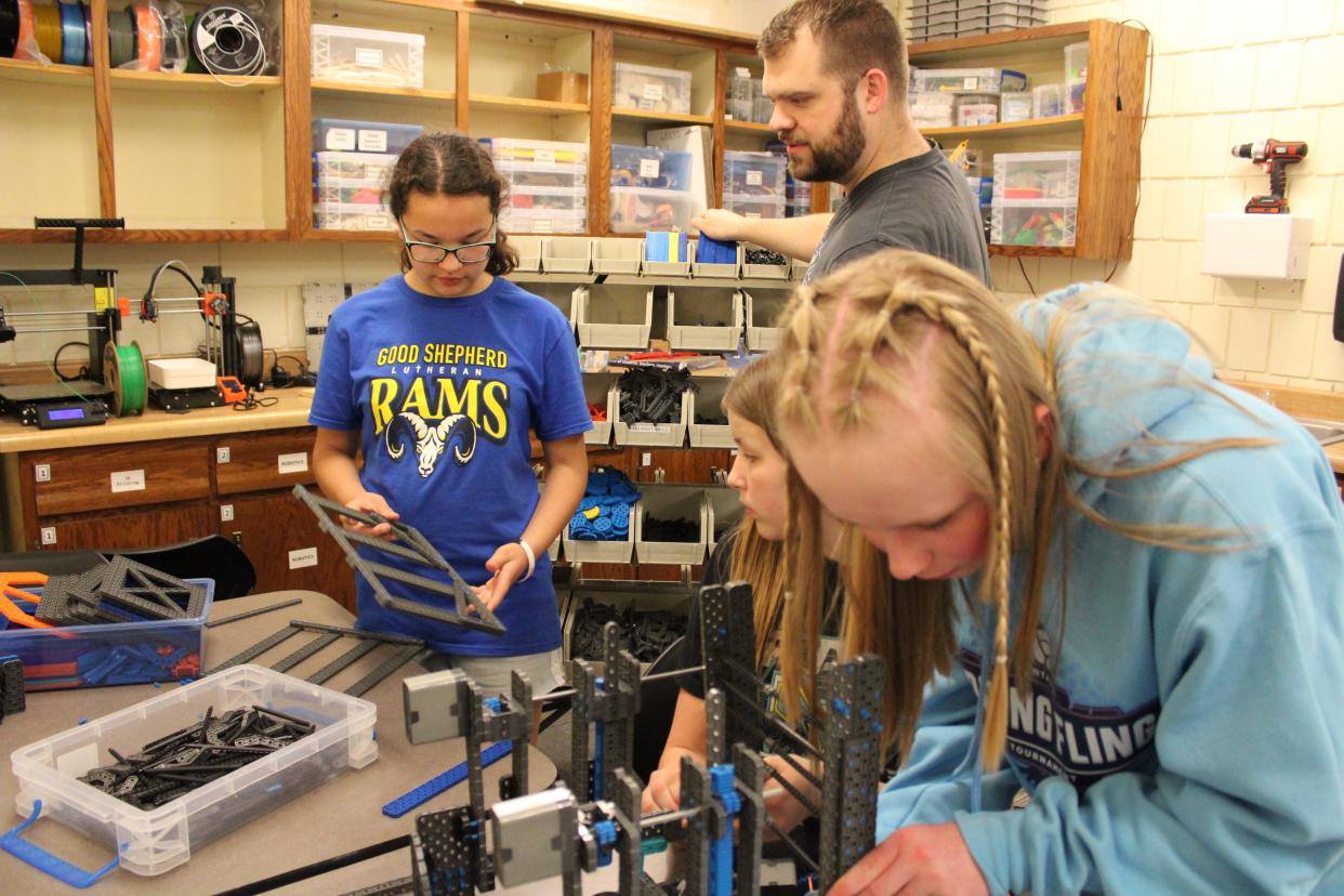 From left to right: Ava Costine, Scott Georgson, Tatum Wright and Lainey Hermanson work on the robot for the Robocore team on Monday, April 15, 2024 at Good Shepherd Lutheran School.