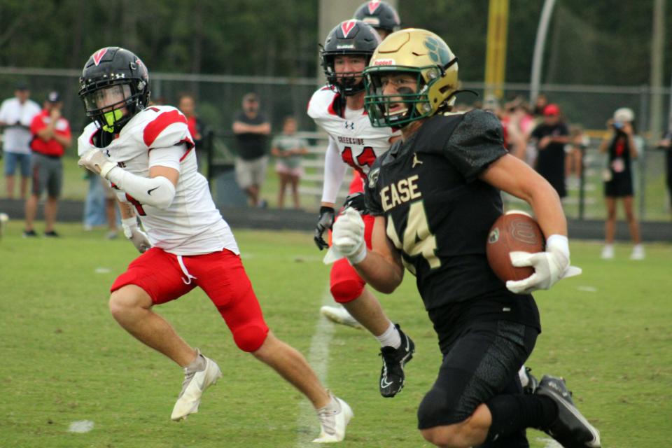 Nease wide receiver Maddox Spencer (14) breaks upfield as Creekside's Parker Mingus (7) and Colton Leavell (11) pursue during a high school football game on September 1, 2023. [Clayton Freeman/Florida Times-Union]