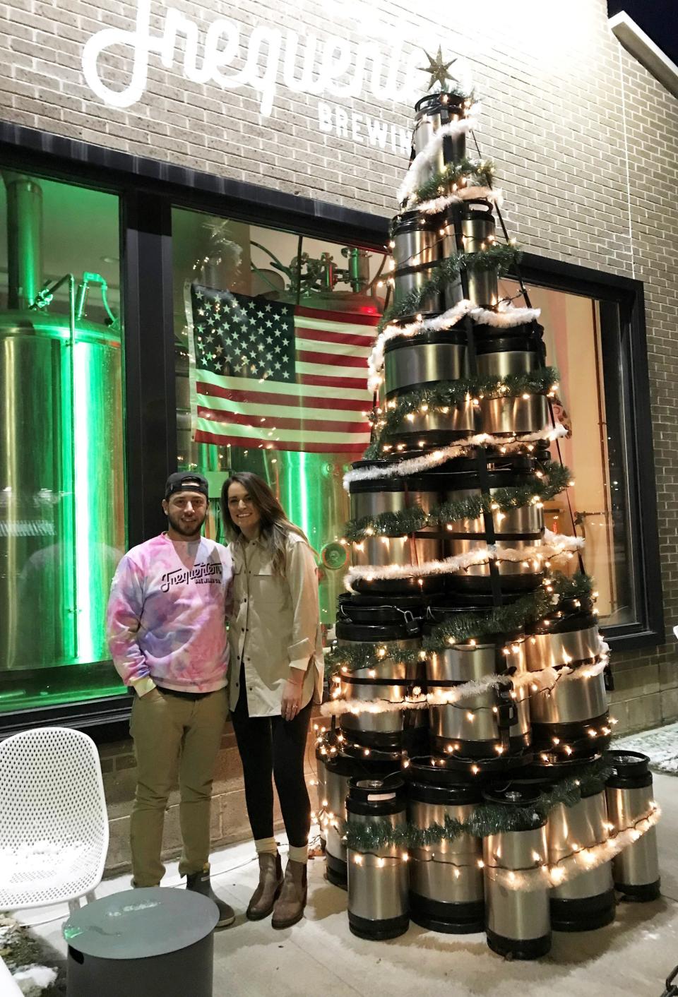 David and Megan D'Allesandro and their Frequentem Brewing Co.'s keg tree do their part to help make Main Street, Canandaigua a festive place for the holidays.
