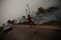 The Wider Image: Indonesia's firefighters on frontline of Borneo's forest blazes