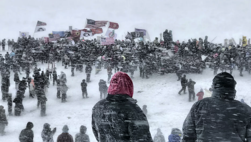 <p>A stirring photo of Standing Rock protestors braving the elements.<br> It won top prize in the ‘America I know’ category (Picture: IPP) </p>