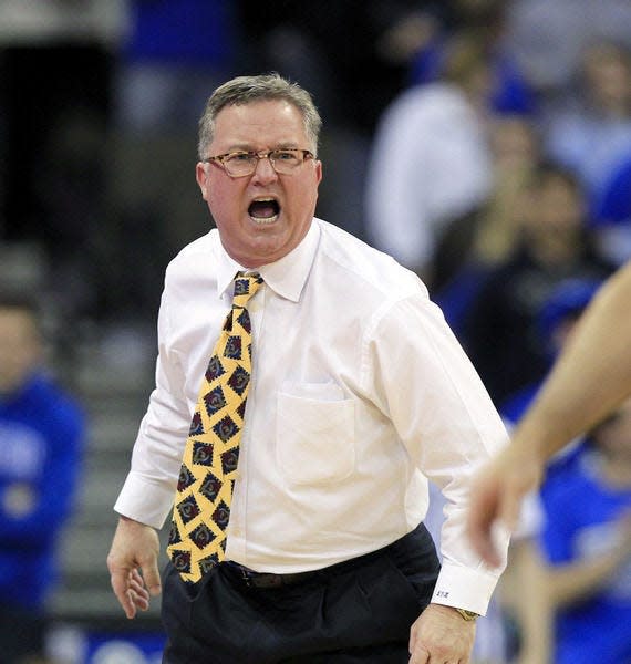 FILE - In this Feb. 19, 2013 file photo, Southern Illinois head coach Barry Hinson yells during the second half og an NCAA college basketball game against Creighton, in Omaha, Neb. Hinson lambasted his players after a loss at Murray State, calling them "uncoachable," a "bunch of mama's boys" and comparing disciplining his young team to housebreaking a puppy. Hinson was not made available for comment Wednesday morning, Dec. 18, 2013. (AP Photo/Nati Harnik, File)