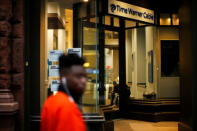 A man walks next to a Time Warner branch in the Manhattan borough in New York, U.S., October 22, 2016. REUTERS/Eduardo Munoz