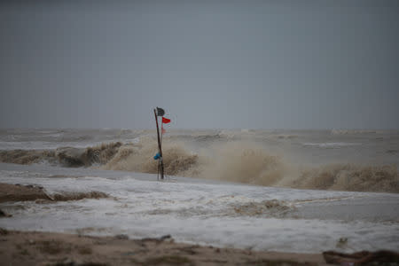 A red flag, warning of dangerous conditions, is seen at a beach as tropical storm Pabuk approaches the southern province of Nakhon Si Thammarat, Thailand, January 4, 2019. REUTERS/Krittapas Chaipimon