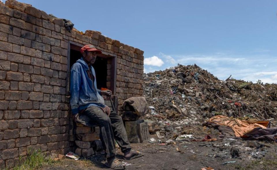 Rabe, a Malagasy scavenger, rests on an abandoned building as he sorts recyclable plastic waste materials at the temporary Anosipatrana dumping site on the outskirts of Antananarivo, Madagascar January 30, 2024.