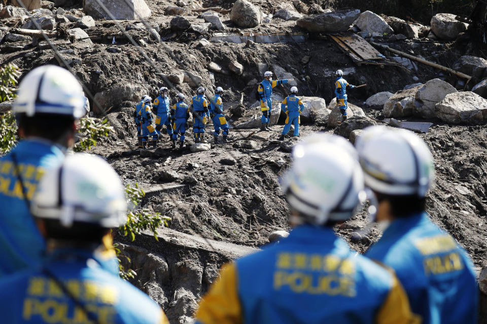 Rescuers search for missing persons at the site of a landslide triggered by Typhoon Hagibis, in Marumori town, Miyagi prefecture, Japan Wednesday, Oct. 16, 2019. The typhoon hit Japan's main island on Saturday with strong winds and historic rainfall that caused more than 200 rivers to overflow, leaving thousands of homes flooded, damaged or without power. (Kota Endo/Kyodo News via AP)