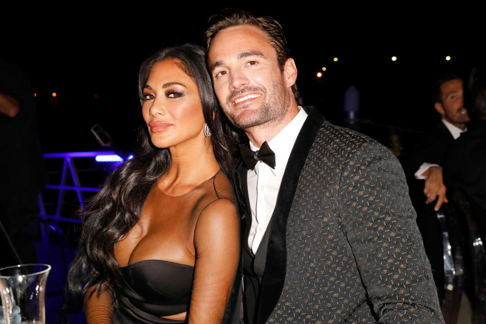 Nicole Scherzinger and Thom Evans show off toned figures during