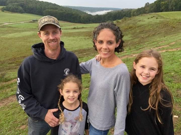 Nicole LaBolle (gray) with her husband and two daughters. Nicole was diagnosed with Parkinson's Disease at 28 years old and is the youngest patient Dr. Kristin Appleby has treated.