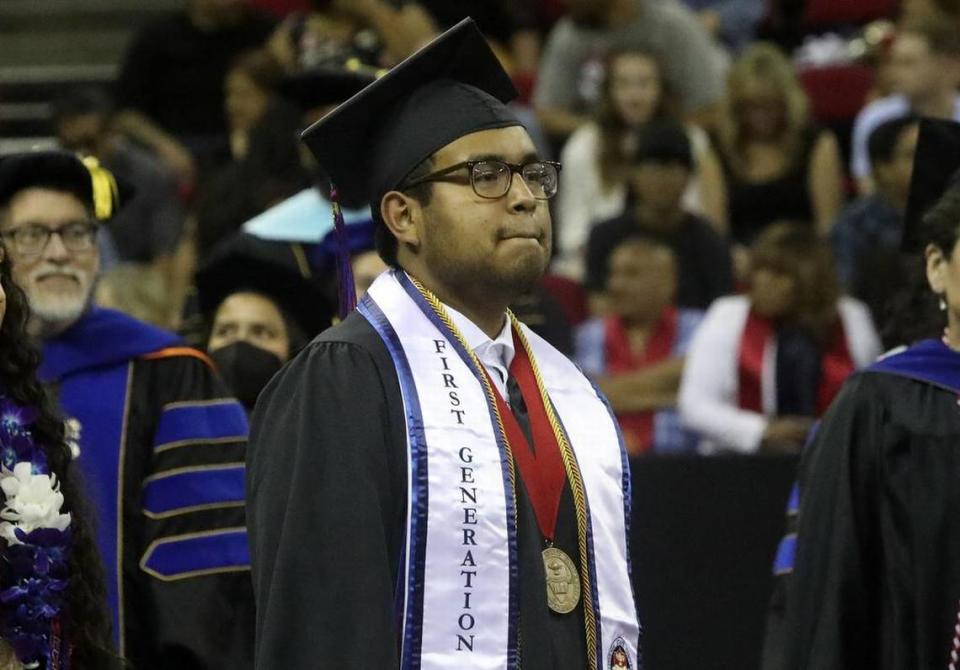 Saúl Pamatz Melgarejo, the graduate dean's medalist from the Kremen School of Education and Human Development, enters Friday night's commencement.