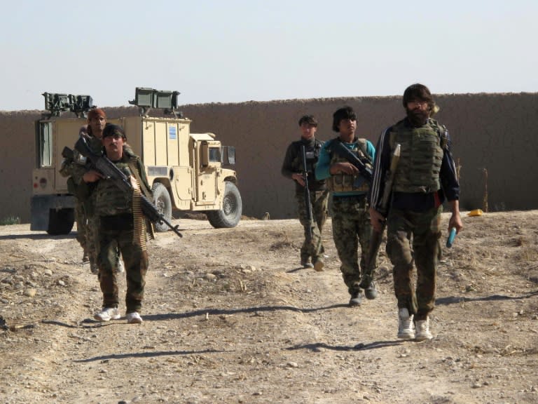 Afghan soldiers march in Helmand, southern Afghanistan on December 21, 2015