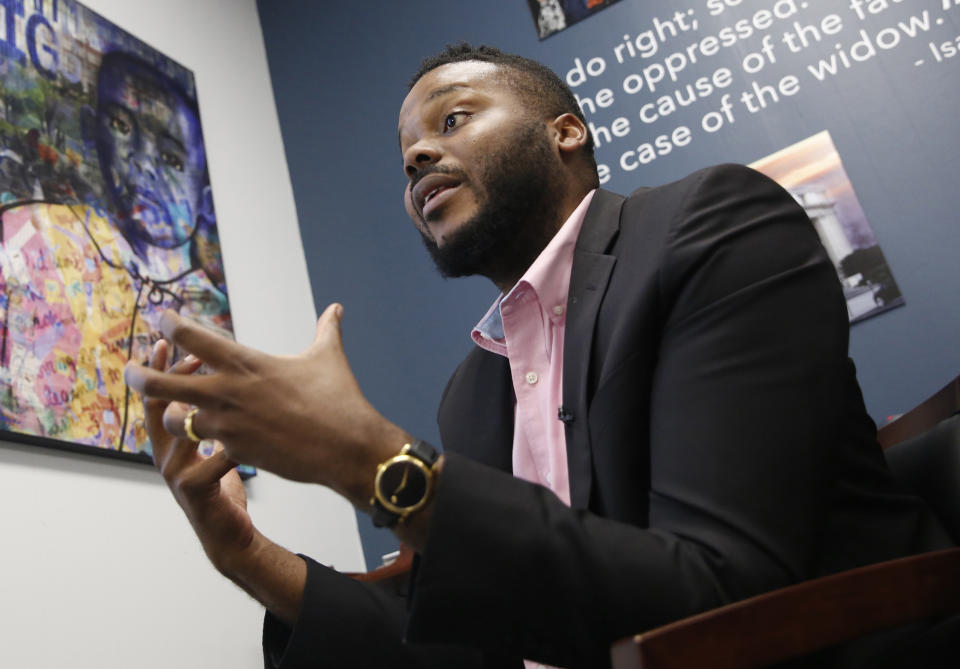 FILE - In this Aug. 14, 2019, file photo, then-Stockton Mayor Michael Tubbs speaks during an interview in Stockton, Calif. A study of people in California who received $500 a month for free says they used it to pay off debt and get full-time jobs. A pair of independent researchers reviewed data from the first year of the study and released their finding on Wednesday, March 3, 2021. Run by a nonprofit founded by Tubbs, the program gave $500 a month to 125 people who lived in census tracts at or below the city's median household income of $46,033. (AP Photo/Rich Pedroncelli, File)