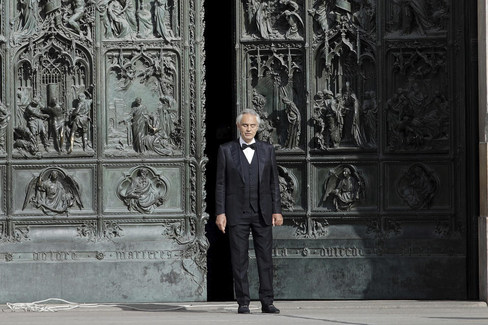 FILE - In this Sunday, April 12, 2020, Italian singer Andrea Bocelli performs outside the Duomo cathedral, in Milan, Italy. Italian tenor Andrea Bocelli, revealing that he had COVID-19 and has since recovered, has donated plasma for use by other coronavirus patients. Bocelli went on Tuesday, May 26, 2020 to a hospital in the Tuscan city of Pisa to donate. Some coronavirus patients have received plasma from former patients as part of their treatment to boost recovery. (AP Photo/Luca Bruno, File)