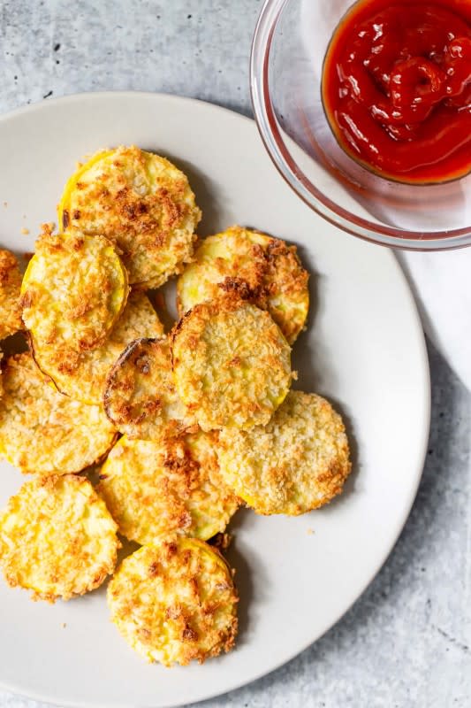 <p>Food Banjo</p><p>This breaded air fried summer squash is the perfect way to use any zucchini or yellow squash you have this summer. </p><p><strong>Get the recipe: <a href="https://www.foodbanjo.com/air-fryer-squash/" rel="nofollow noopener" target="_blank" data-ylk="slk:Air Fryer Yellow Squash;elm:context_link;itc:0;sec:content-canvas" class="link ">Air Fryer Yellow Squash</a></strong></p>
