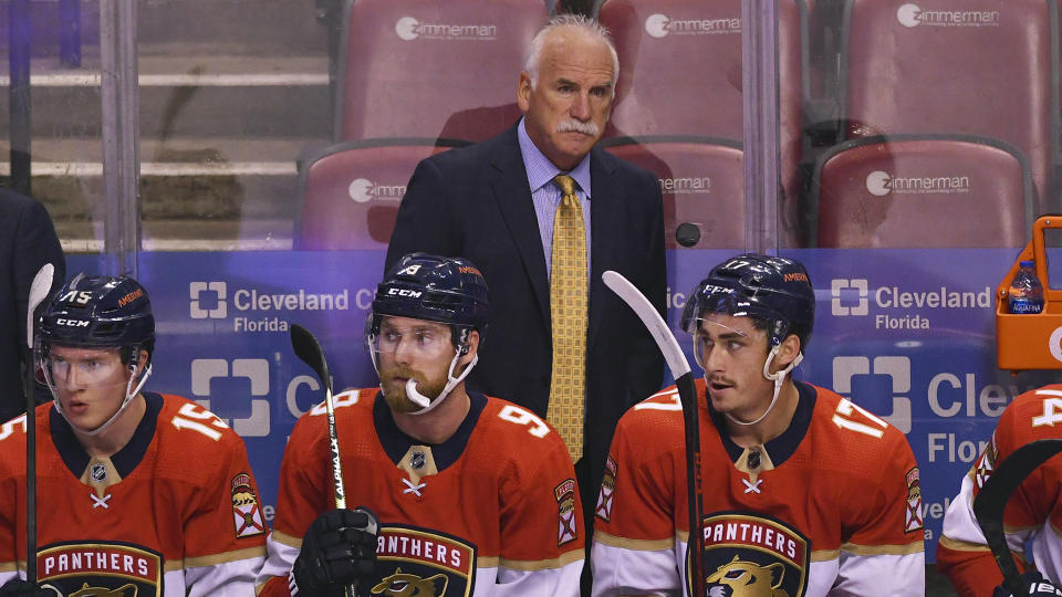 Florida Panthers head coach Joel Quenneville looks on from the bench during the first period of an NHL hockey game against the Colorado Avalanche, Tuesday, Oct. 21, 2021, in Sunrise, Fla. (AP Photo/Jim Rassol)