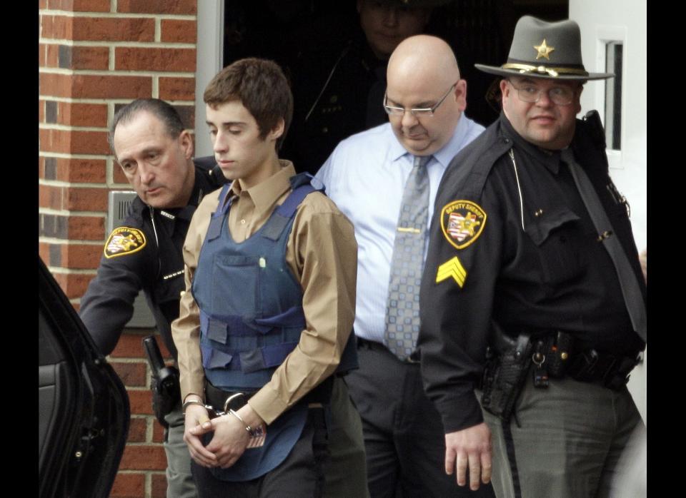 A student opens fire in a cafeteria at Chardon High School in Ohio, killing three students and injuring two others before being arrested.<br>  <em>Caption: In this Tuesday, Feb. 28, 2012, photo, seventeen-year-old T.J. Lane is led from Juvenile Court by Sheriff's deputies in Chardon, Ohio, after his arraignment in the shooting of five high school students. (AP Photo/Mark Duncan)</em>