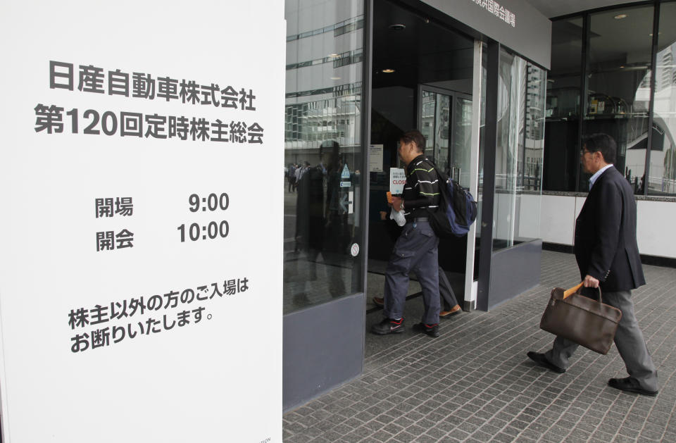 Shareholders arrive for Nissan's general meeting of shareholders in Yokohama, near Tokyo, Tuesday, June 25, 2019. Japanese automaker Nissan faces shareholders as profits and sales tumble after its former star chairman faces trial on financial misconduct allegations. (AP Photo/Koji Sasahara)