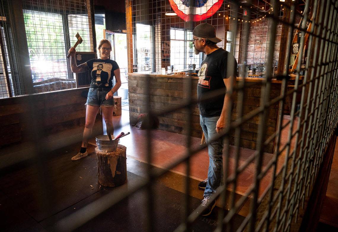 Casting Iron already has barricades set up around its ax throwing lanes, a requirement for alcohol service under the Washington liquor board’s new rules.
