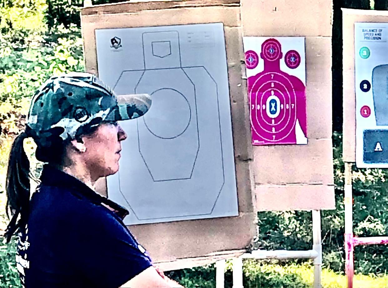Christy Knopp, co-founder along with Andrea Barkley of C-BAR Firearms Training, prepares for a September Armed Women of American (Augusta County branch) shooting exercise.