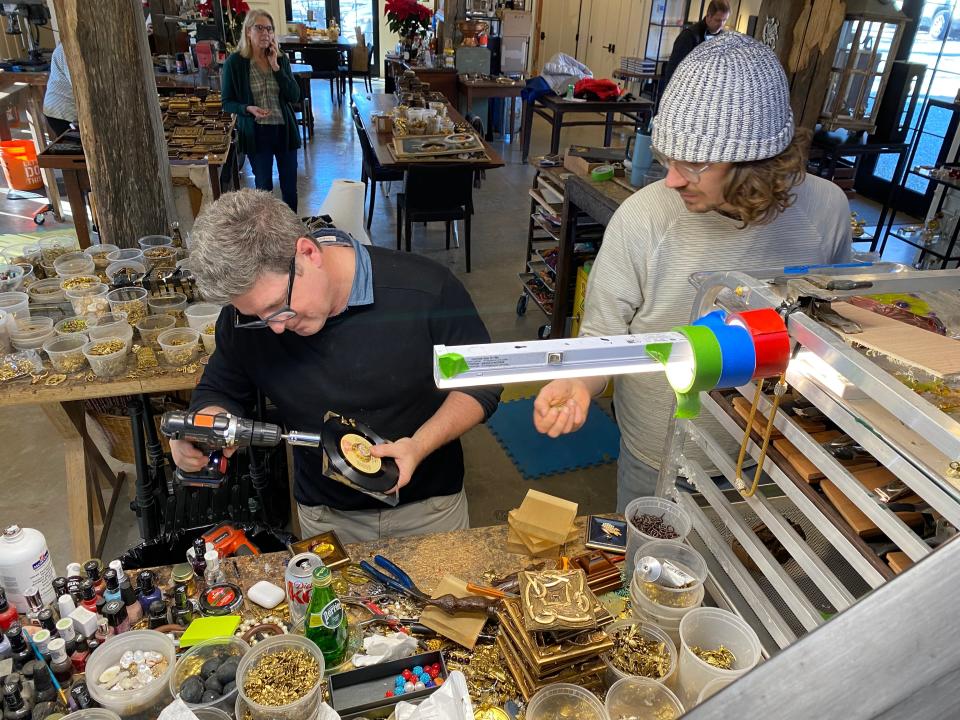 Trace Mayer (left) and Garrett Stansbury (right) work on a project at Museum Bees, 12404 Ridge Road, Anchorage, Kentucky