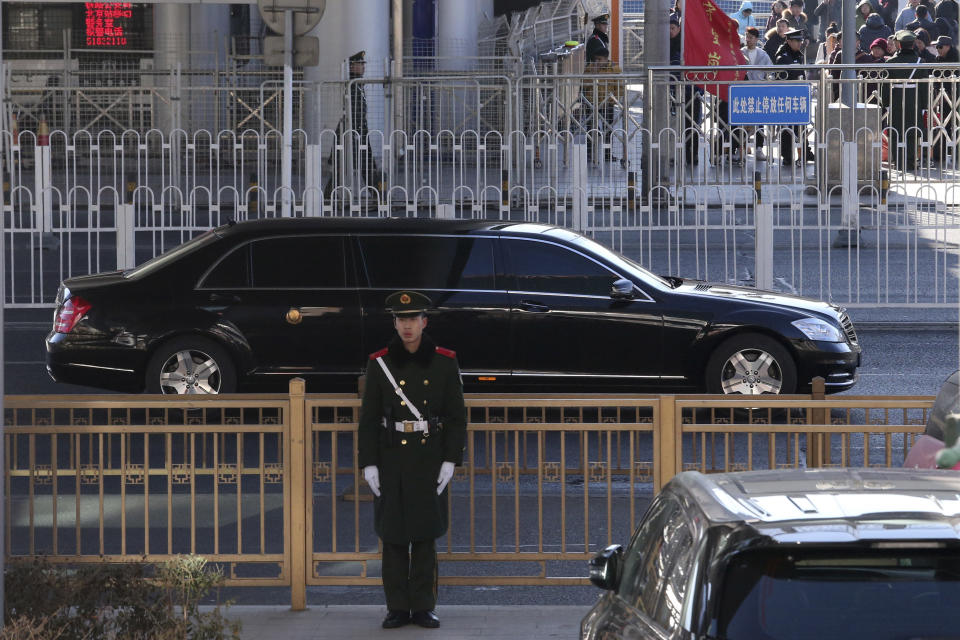 In this Jan. 8, 2019, file photo, a stretched Mercedes limousine believed to carrying North Korean leader Kim Jong Un leaves a train station with a convoy in Beijing, China. (AP Photo/Ng Han Guan, File)