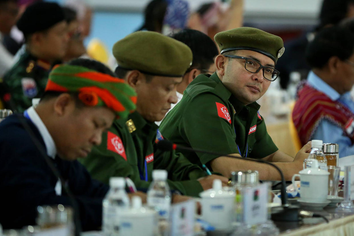 Leaders of the Arakan Army, ethnic rebel group, gather with other rebel leaders and representatives of various Myanmar ethnic rebel groups at the opening of a four-day conference in Mai Ja Yang, a town controlled by the Kachin Independence Army (KIA) in northern Kachin State on July 26, 2016. The conference is organized by the rebel leaders ahead of the August planned peace conference by Aung San Suu Kyi's new civilian-led government. Suu Kyi has made peace a flagship policy of her new government, which took over in March after decades of brutal junta rule while conflicts continue to rage in several areas between ethnic minority armed groups and the army. Some 240,000 people have been displaced nationwide due to unrest and communal conflict. / AFP / STR        (Photo credit should read STR/AFP/Getty Images)