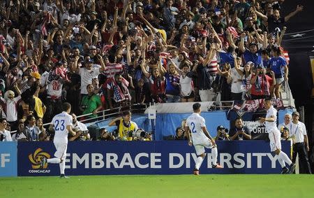 October 10, 2015; Pasadena, CA, USA; USA midfielder Bobby Wood (11) celebrates with midfielder Jermaine Jones (13) and defender DeAndre Yedlin (2) his goal scored against Mexico during extra time in the CONCACAF Cup at Rose Bowl. Mandatory Credit: Gary A. Vasquez-USA TODAY Sports