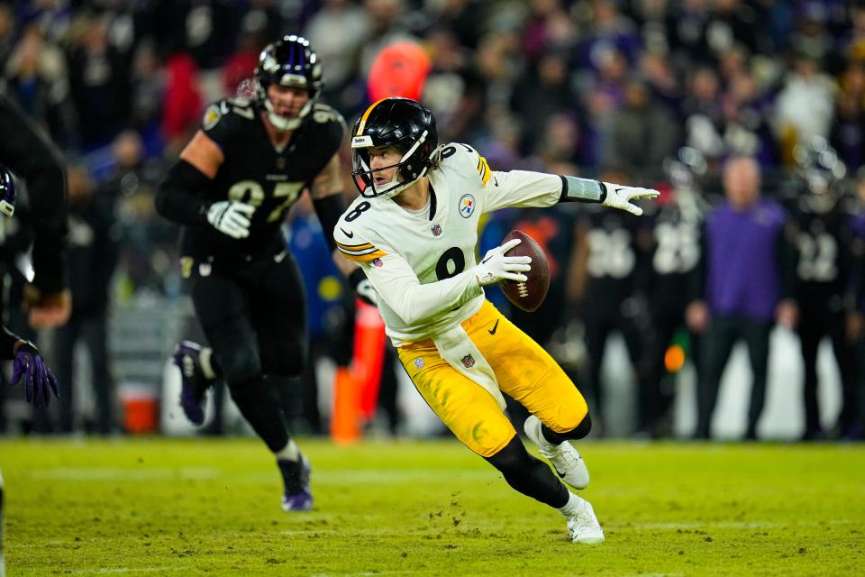 Pittsburgh Steelers quarterback Kenny Pickett (8) scrambles against the Baltimore Ravens in the second half of an NFL football game in Baltimore, Fla., Sunday, Jan. 1, 2023. (AP Photo/Julio Cortez)