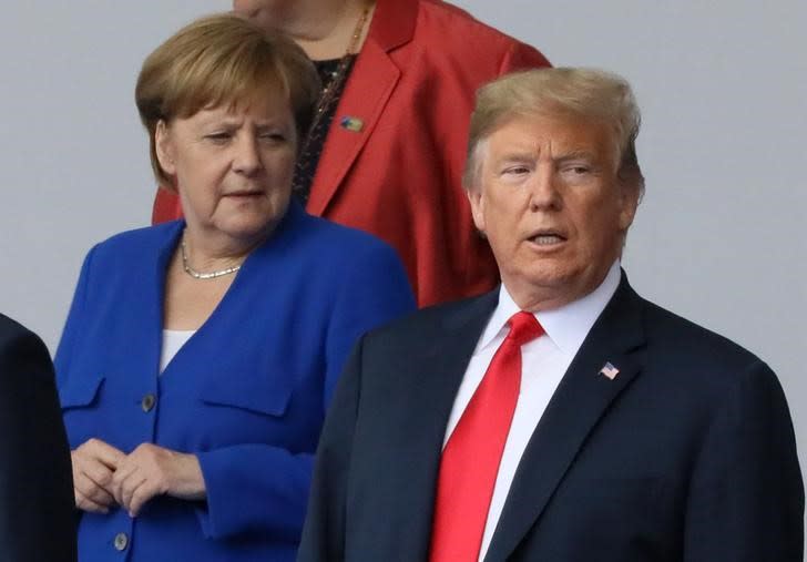 Angela Merkel and Donald Trump at the Nato summit in Brussels (Reuters)