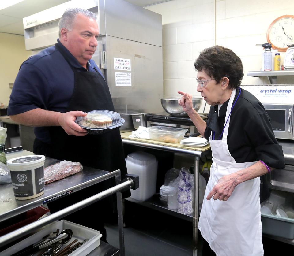 Chef Beau Schmidt works in the kitchen with his mother, Jerry Schmidt, at Beau's Grille in the Akron-Fairlawn Hilton.