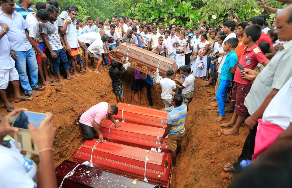 <p>Sri Lankan villagers prepare to bury victims of a landslide at a cemetery in Bellana village, in Kalutara district in, Sri Lanka, Saturday, May 27, 2017. Sri Lanka has appealed for outside help as dozens were killed in floods and mudslides and dozens others went missing. (AP Photo/Eranga Jayawardena) </p>