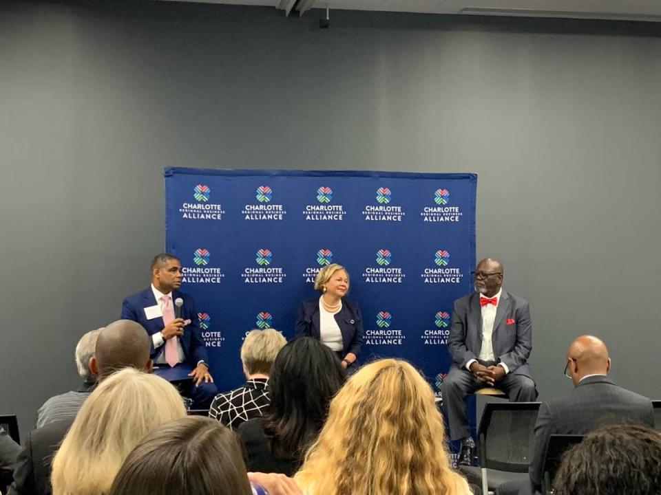 Kieth Cockrell, president of Bank of America Charlotte, asks Charlotte Mayor Vi Lyles and Mecklenburg County Chairman George Dunlap questions at a Charlotte Regional Business Alliance event.