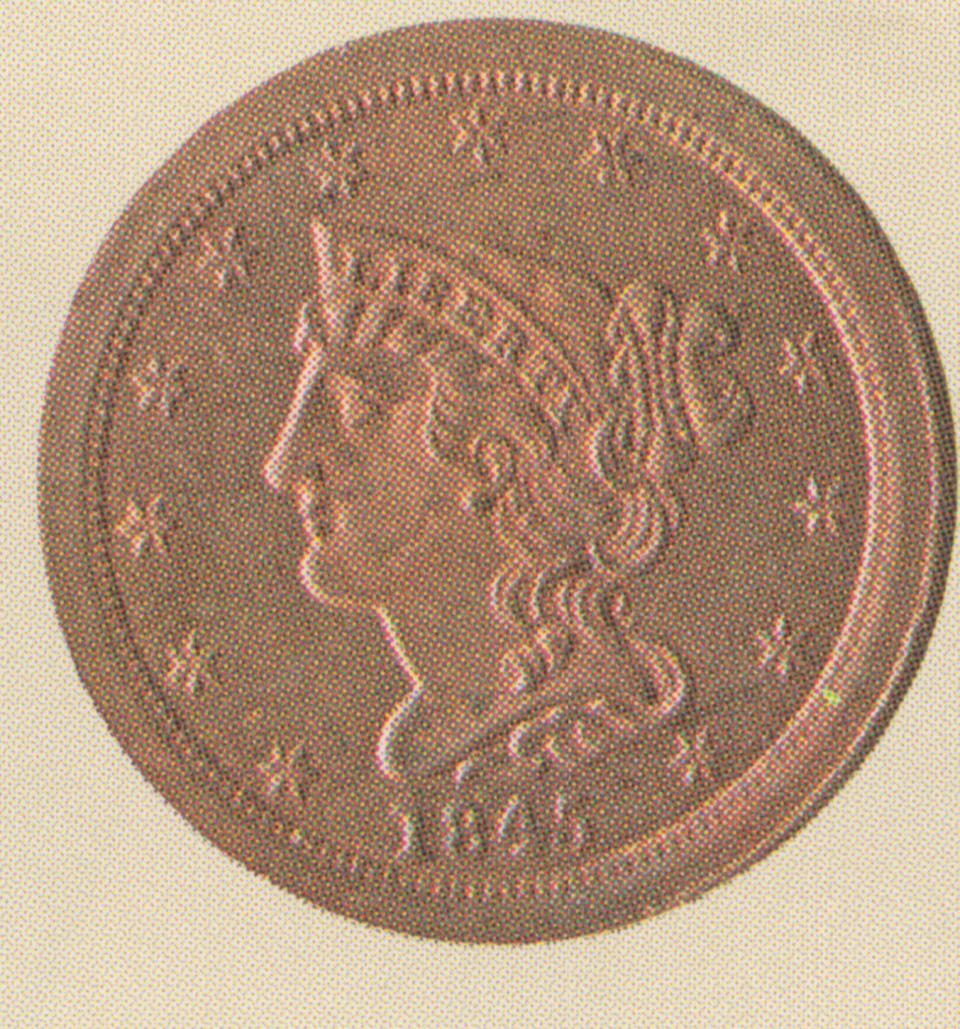 Close-up of half-cent coin dated 1845