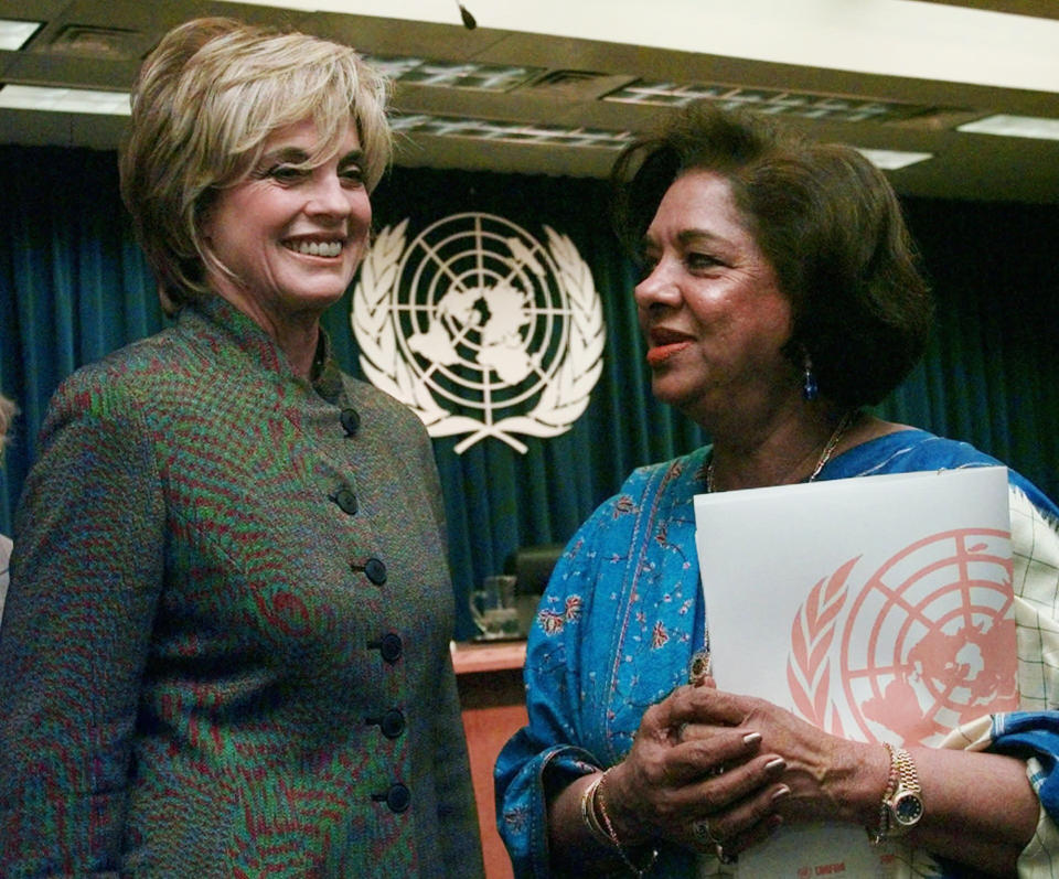 FILE - American Actress Linda Gray, left, talks with Nafis Sadik, executive director of the United Nations Population Fund, after a U.N. news conference on Jan. 20, 1998. Sadik, a Pakistani doctor who championed women's health and rights and spearheaded the breakthrough action plan adopted by 179 countries at the 1994 U.N. population conference, died four days before her 93rd birthday, her son said late Monday, Aug. 15, 2022. Omar Sadik said his mother died of natural causes at her home in New York on Sunday night. (AP Photo/Richard Drew, File)