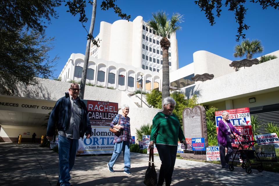 People leave the Nueces County Courthouse after voting in the Primary Election on Tuesday, Feb. 20, 2024, in Corpus Christi, Texas. Tuesday was the first day of early voting.