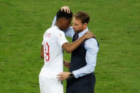 Soccer Football - World Cup - Semi Final - Croatia v England - Luzhniki Stadium, Moscow, Russia - July 11, 2018 England manager Gareth Southgate and Marcus Rashford look dejected after the match REUTERS/Christian Hartmann