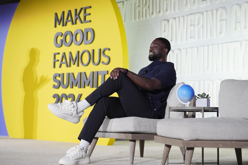 NBA Hall of Famer Dwyane Wade waits to speak after having received the Elevate Prize Catalyst Award, Thursday, May 23, 2024, at the Make Good Famous Summit in Miami Beach, Fla. Wade has launched Translatable, a nonprofit online community dedicated to supporting transgender youth. (AP Photo/Wilfredo Lee)