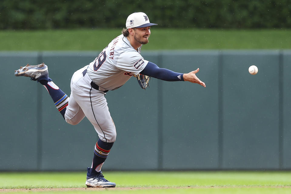 Detroit Tigers shortstop Zach McKinstry flips the ball to second base on a fielder's choice hit by Minnesota Twins' Austin Martin during the second inning of a baseball game, Thursday, July 4, 2024, in Minneapolis. (AP Photo/Matt Krohn)