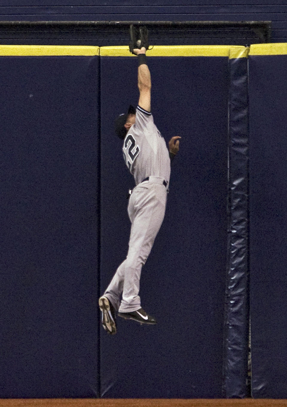 New York Yankees center fielder Jacoby Ellsbury robs Tampa Bay Rays' Ben Zobrist of an extra-base hit during the fourth inning of a baseball game Friday, April 18, 2014, in St. Petersburg, Fla. (AP Photo/Steve Nesius)