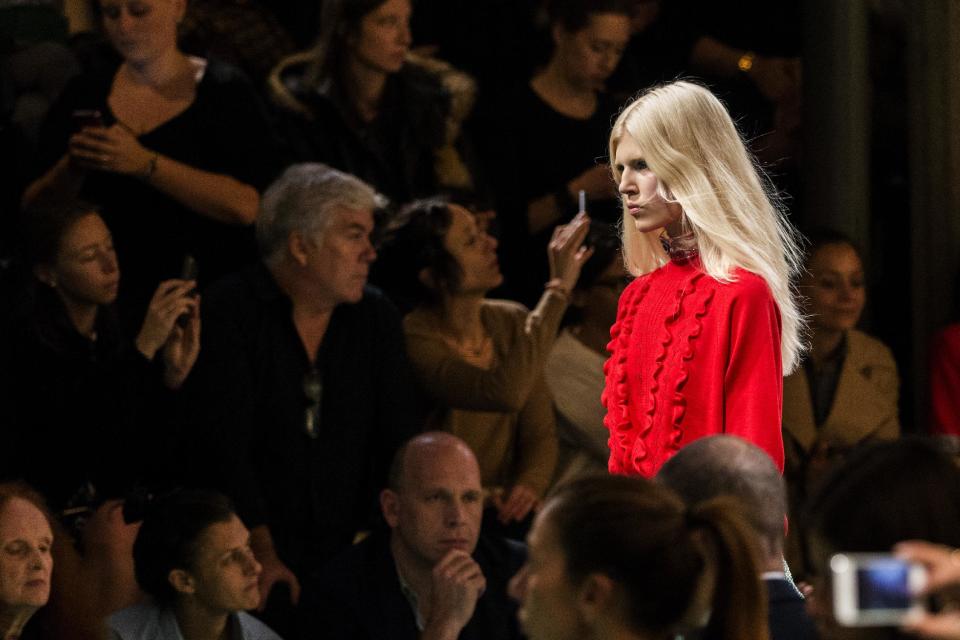 A model presents a creation as part of Miu Miu's ready-to-wear Spring/Summer 2014 fashion collection, presented Wednesday, Oct. 2, 2013 in Paris. (AP Photo/Jacques Brinon)