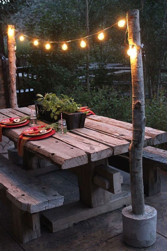 <p>Make these DIY string light poles to create a simple overhang for your backyard picnic table.</p><p><strong>Get the tutorial at <a href="http://blog.homedepot.com/string-light-pole-with-concrete-base/?crlt.pid=camp.PGTN7tVfGK4B" rel="nofollow noopener" target="_blank" data-ylk="slk:Home Depot;elm:context_link;itc:0;sec:content-canvas" class="link ">Home Depot</a>.</strong></p><p><strong><a class="link " href="https://www.amazon.com/Backyard-Hanging-Outdoor-Pergola-Deckyard/dp/B00RQHBZVS/ref=sr_1_5?tag=syn-yahoo-20&ascsubtag=%5Bartid%7C10050.g.3404%5Bsrc%7Cyahoo-us" rel="nofollow noopener" target="_blank" data-ylk="slk:Shop string lights;elm:context_link;itc:0;sec:content-canvas">Shop string lights</a><br></strong></p>