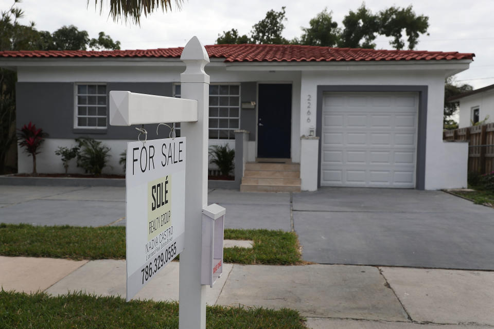 MIAMI, FL - JANUARY 24:  A for sale sign is seen in front of a home as the  National Association of Realtors released a report showing that home sales dropped in December of 2017 on January 24, 2018 in Miami, Florida. According to their report, 'In December, existing-home sales slipped 3.6 percent to a seasonally adjusted annual rate of 5.57 million from a downwardly revised 5.78 million in November.'  (Photo by Joe Raedle/Getty Images)