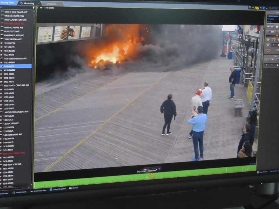 A video monitor inside the surveillance center of the Atlantic City, N.J., police department on Nov. 16, 2023, shows a video recording of the beginning of a fire outside Resorts casino a day earlier. The city plans to add hundreds of additional security cameras to the 3,000 that already keep an electronic eye on the seaside gambling resort. (AP Photo/Wayne Parry)