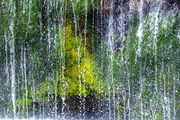 Shiraito Falls in Karuizawa is known for its veil-like water and vibrant green moss.