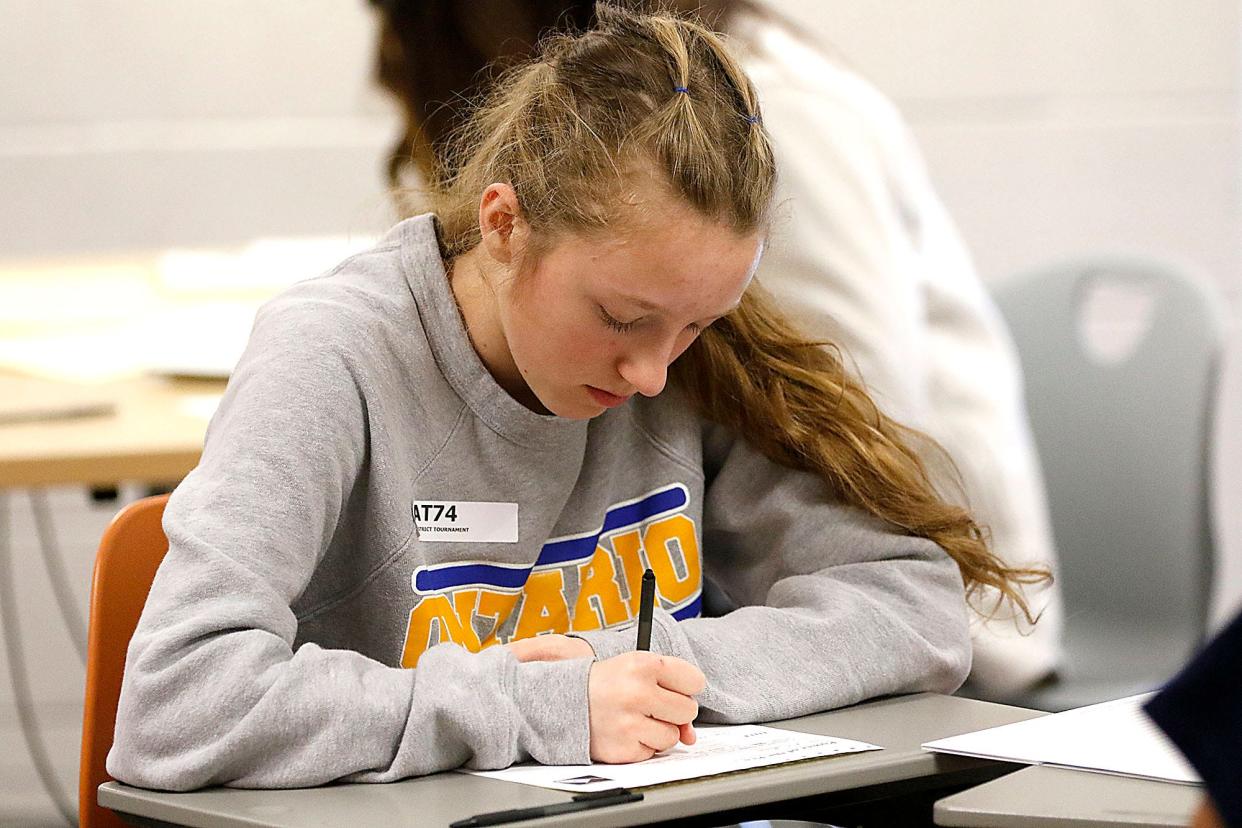 Ontario Middle School seventh grader Leeah Ziegler works on a writing prompt during the Power of the Pen district tournament held at Ashland Middle School  Saturday, Jan. 21, 2023. TOM E. PUSKAR/ASHLAND TIMES-GAZETTE