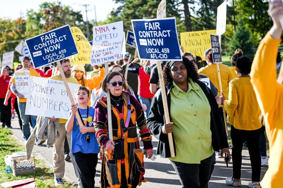 Participants march during a nurses rally pushing for better work conditions on Monday, Oct. 3, 2022, outside McLaren Greater Lansing Hospital.