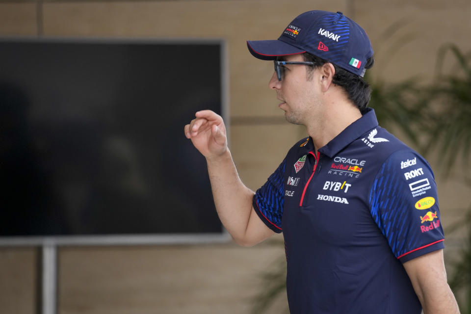 Red Bull driver Sergio Perez of Mexico walks through the paddock at the Lusail International Circuit, Lusail, Qatar, Thursday, Oct. 5, 2023. The Qatar Formula One Grand Prix race will be held on Sunday. (AP Photo/Darko Bandic)